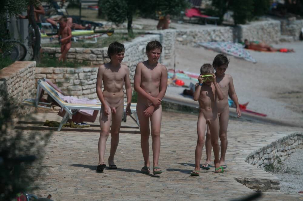 Shore walking nude - Nudism is part of life