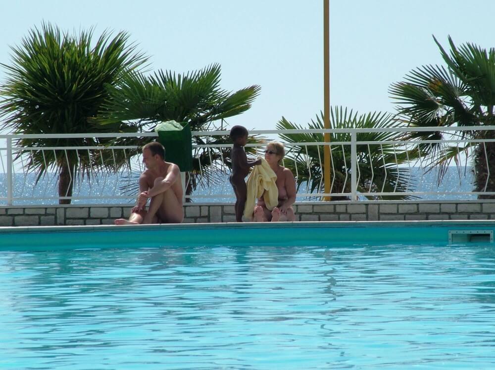 Photo of naturists in an outdoor pool - Nudism has been around for a very long time